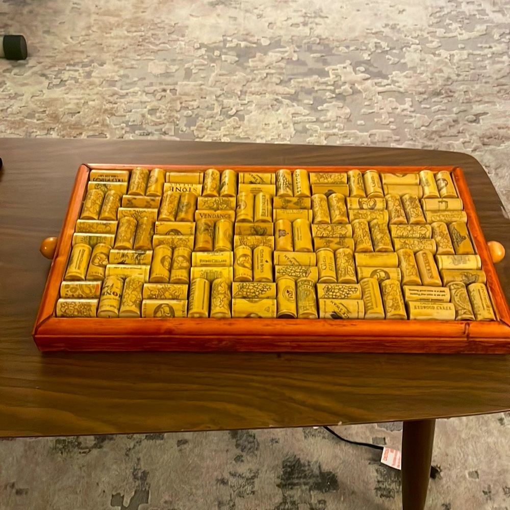 Selling a Corkscrew embedded decorated wood side platter/table.